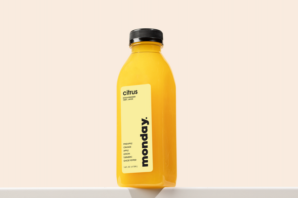 Citrus cold-pressed juice featuring pineapple, orange, apple, lemon, and turmeric.