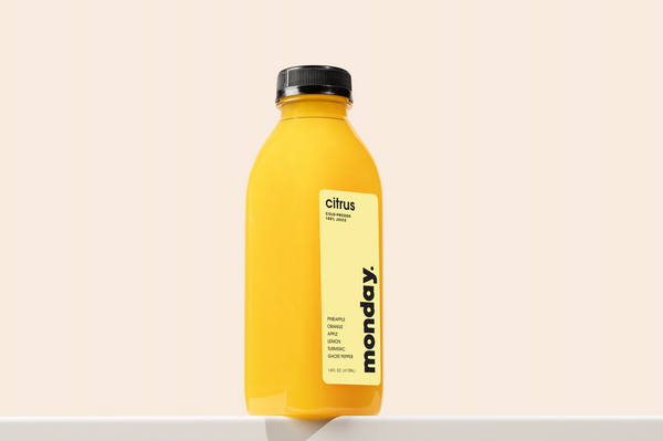 Citrus cold-pressed juice featuring pineapple, orange, apple, and turmeric.