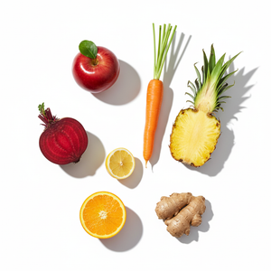 Roots Cold-pressed Juice ingredients including beet, carrot, apple, ginger, lemon, and pineapple.