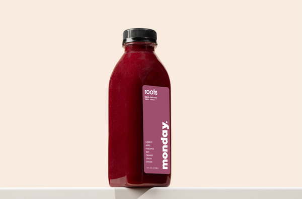Roots Cold-pressed Juice bottle featuring beet and carrot wellness blend for energizing nourishment.